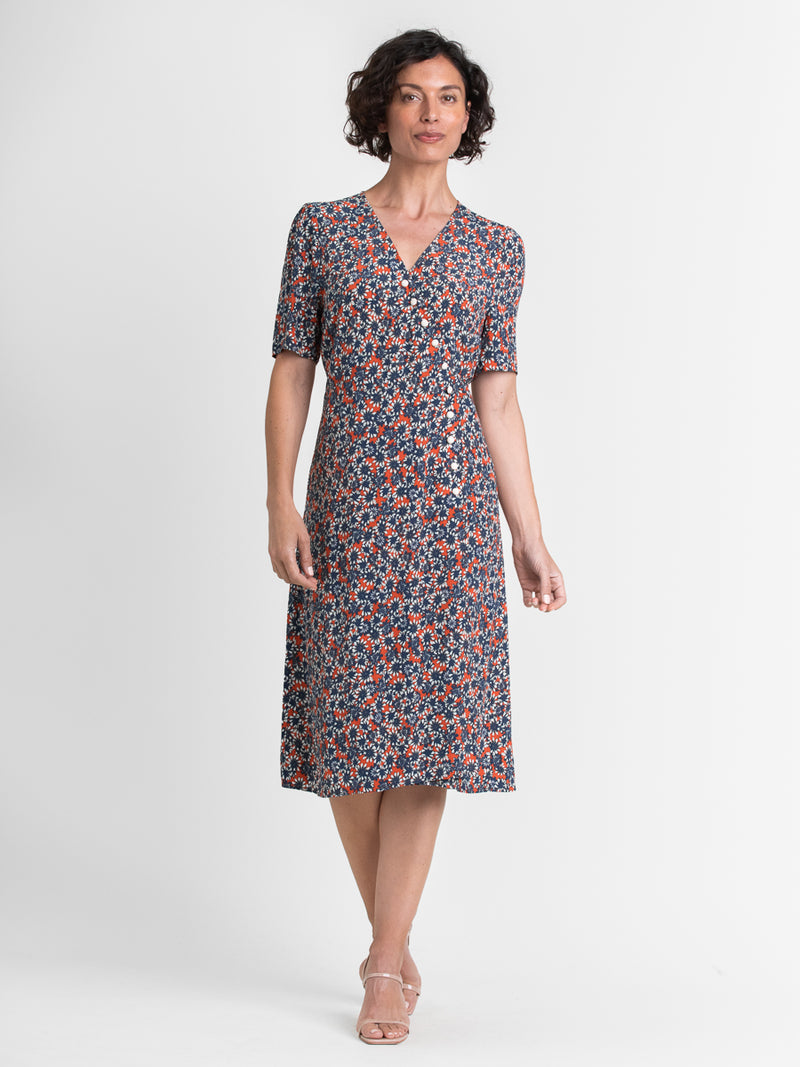 Woman wearing the French Daisy Dress by Margaret O'Leary.