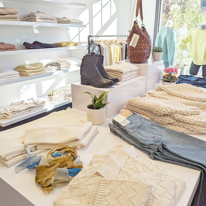 Table display of knitwear at the Margaret O'Leary Berkeley store.
