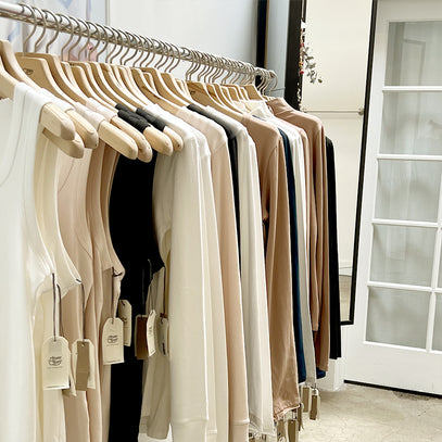 Knitwear hanging on rack at the Margaret O'Leary Boston store.
