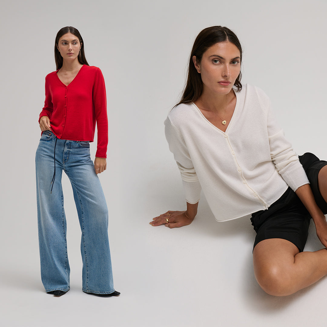 Two women wearing different colors of the Cashmere Vee Cardi by MargaretO'Leary on a plain background