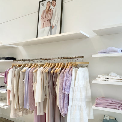 Knitwear display hanging on rack at the Margaret O'Leary Denver store.
