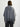 Woman wearing a mid-grey Fringe Poncho by Margaret O'Leary on a white background.
