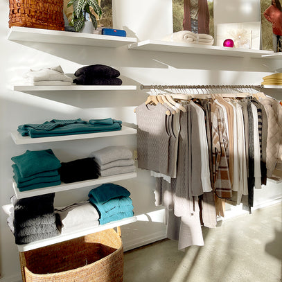 Knitwear display on shelves and hanging on rack at the Margaret O'Leary Fillmore store.