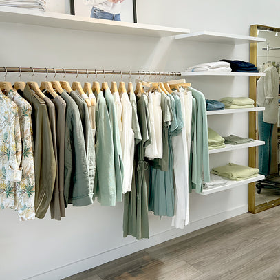 Knitwear display hanging on rack at the Margaret O'Leary Santa Monica store.