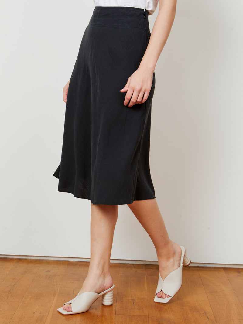 Woman wearing the Provence Circle Skirt in Black by Margaret O'Leary.
