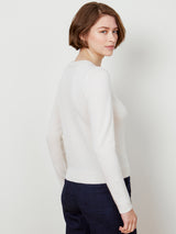 Woman wearing the cashmere pullover in ivory by Margaret O'Leary.