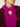 Woman wearing a Cashmere Triangle Scarf by Margaret O'Leary, a magenta scarf on a plain background.