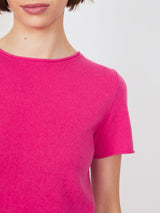 Woman wearing the cashmere tee in fuchsia by Margaret O'Leary.