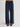 Person wearing Navy blue Sadie Pants with a matching belt by Margaret O'Leary on a plain background