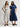 Two women wearing Tiered VNeck Dresses by Margaret O'Leary standing side by side against a white background