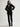 Woman wearing the black cashmere St. Germaine Coat by Margaret O'Leary on a white background
