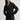 Woman wearing the black cashmere St. Germaine Coat by Margaret O'Leary on a white background