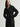 Woman wearing the black cashmere St. Germaine Coat by Margaret O'Leary on a white background