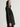 Woman wearing the black cashmere St. Germaine Coat by Margaret O'Leary on a white background