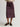 Person wearing a Purple blue Sandra Skirt with a matching belt by Margaret O'Leary on a plain background