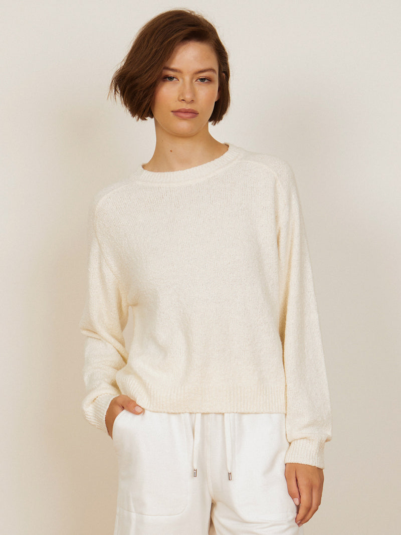 Woman wearing the Lola Pullover in Ivory by Margaret O'Leary.
