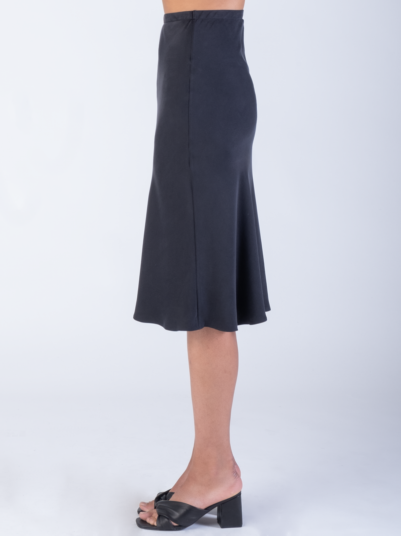 Model wearing a black skirt.