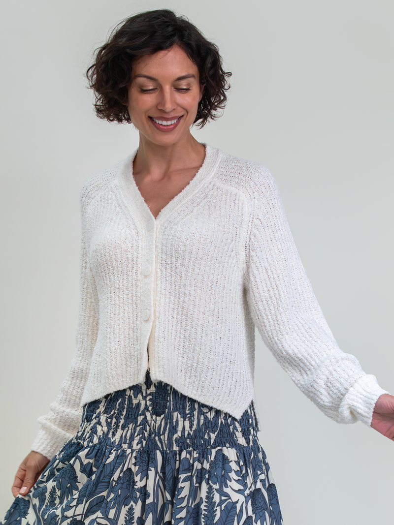 Woman wearing the Hadley Cardigan in Coconut by Margaret O'Leary.