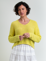 Woman wearing the Lounge Vee in Citrine by Margaret O'Leary.