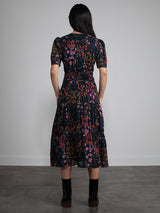 Female model wearing floral dress.