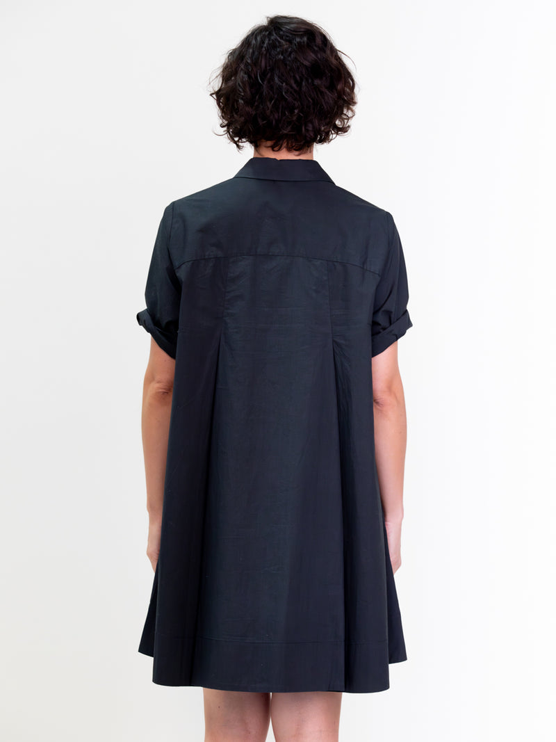 Woman wearing the Voluminous Shirt Dress in Black by Margaret O'Leary.