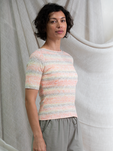 Woman wearing the Ombre Rib Tee in Sunset by Margaret O'Leary.