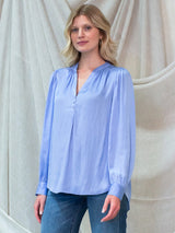 Woman wearing the Poet Top by Margaret O'Leary.
