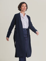 Woman wearing the Midi Belted Coat in Navy by Margaret O'Leary.