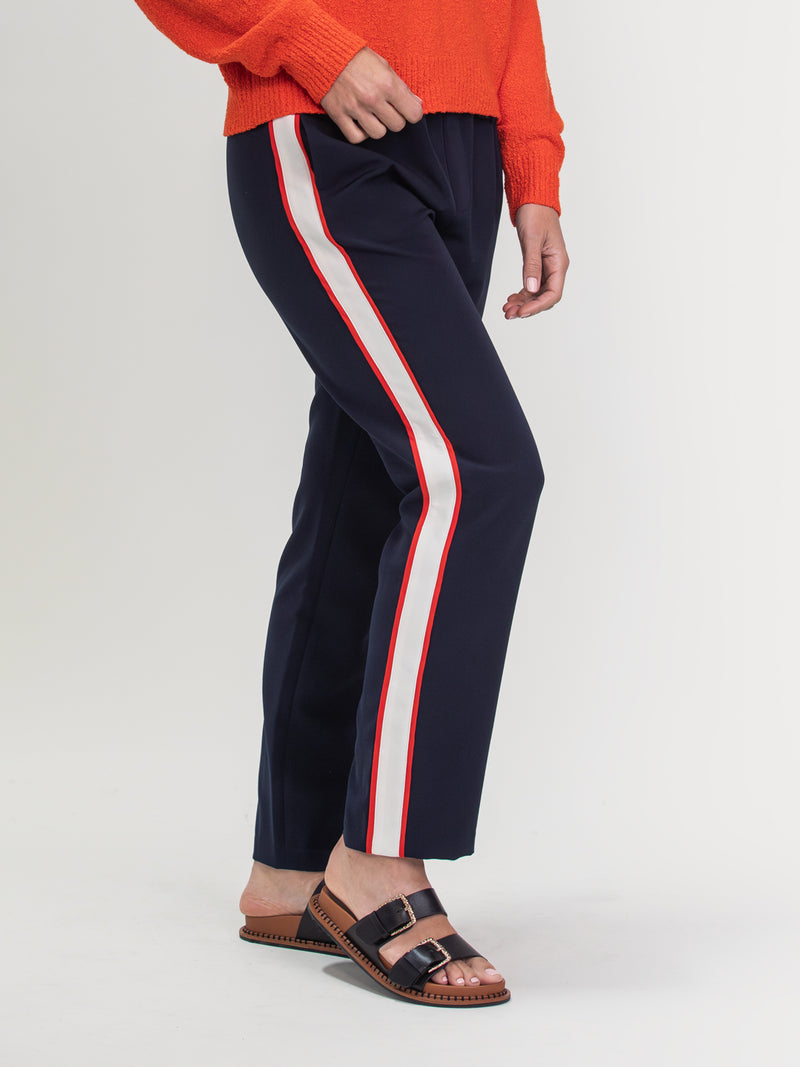 Woman wearing the Sporty Pant in Navy by Margaret O'Leary.