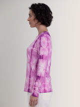 Woman wearing a purple tie dye long sleeve tee by Margaret O'Leary.