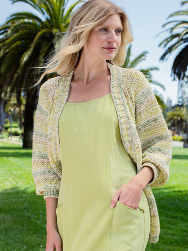 Woman wearing the Open Stitch Cardi in Meadow by Margaret O'Leary.
