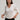 Cashmere Vee Cardigan by Margaret O’Leary, lightweight cashmere cardigan with V neckline and button-front closure.