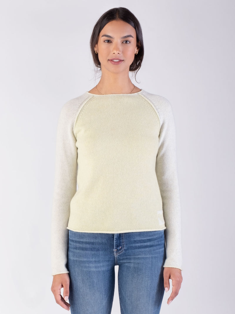 woman wearing a green cashmere sweater.