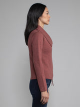 Female wearing cinnamon moto jacket. 