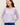 Woman wearing a purple lace knit Lace Cashmere Cardigan by Margaret O'Leary with blue jeans.