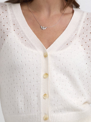 The Perforated Vee Cardigan by Margaret O'Leary.