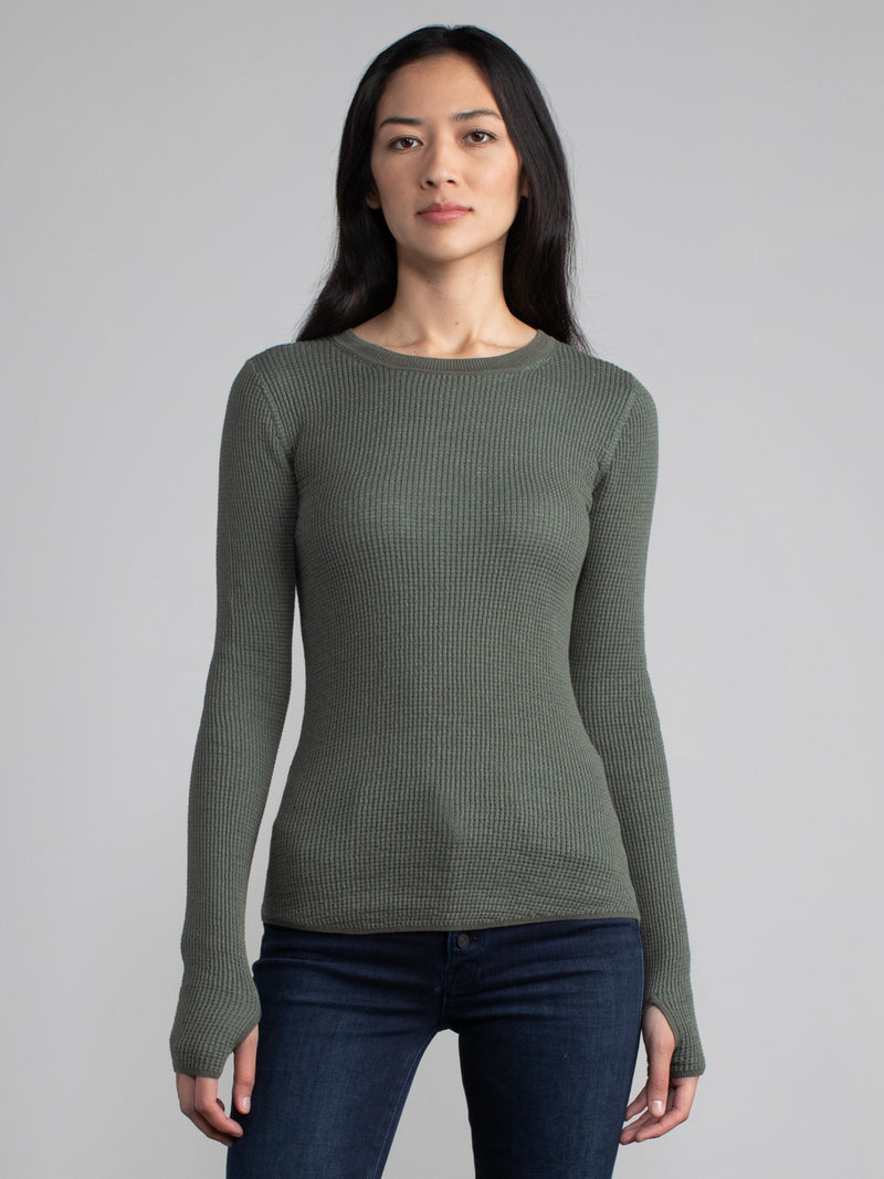Female model in a green long sleeve