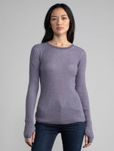 Female model in a purple long sleeve