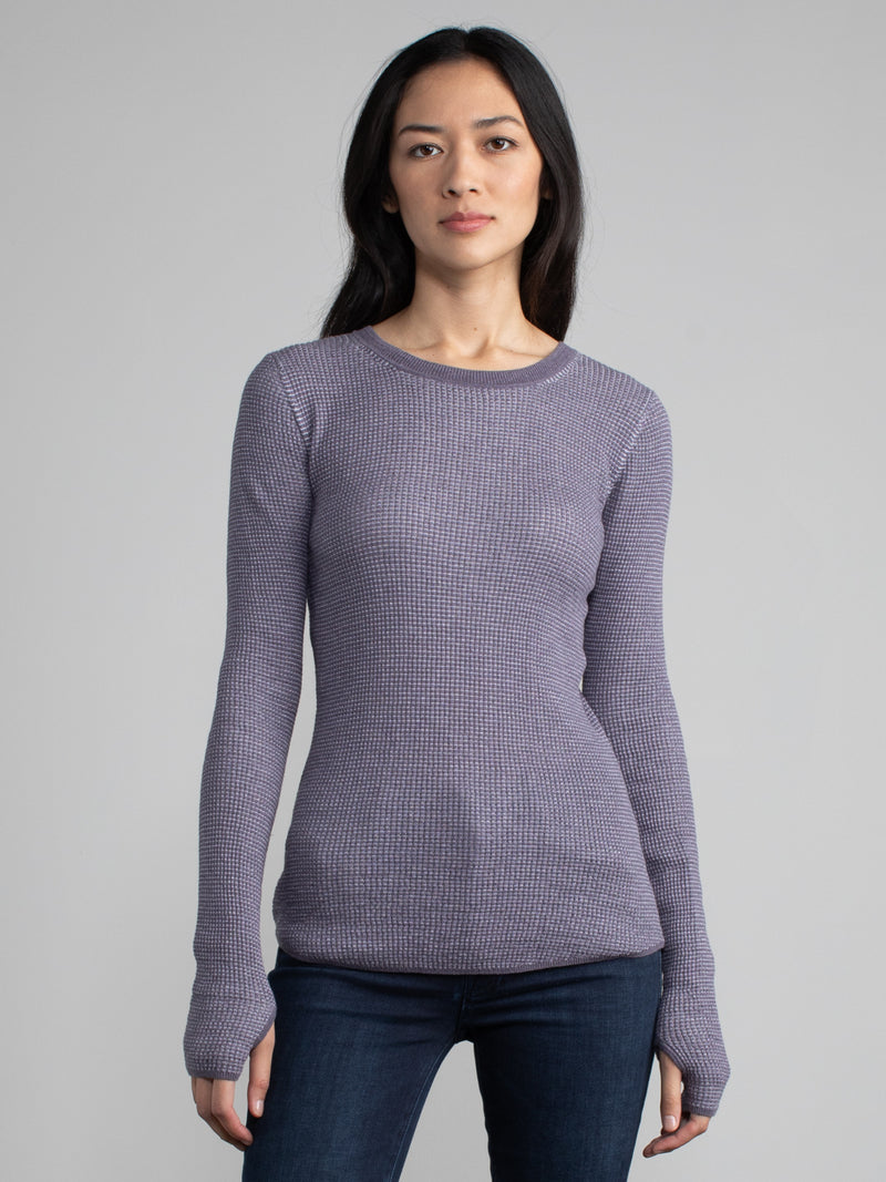 Female model in a purple long sleeve