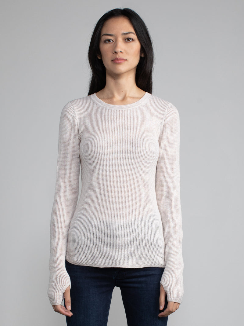 Female model in a white long sleeve