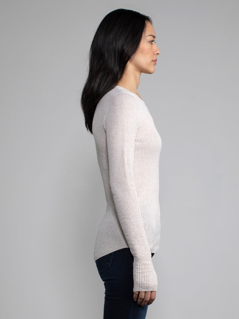 Female model in a white long sleeve