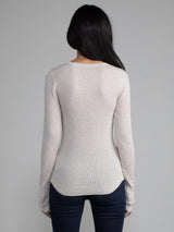 Female model in a white long sleeve