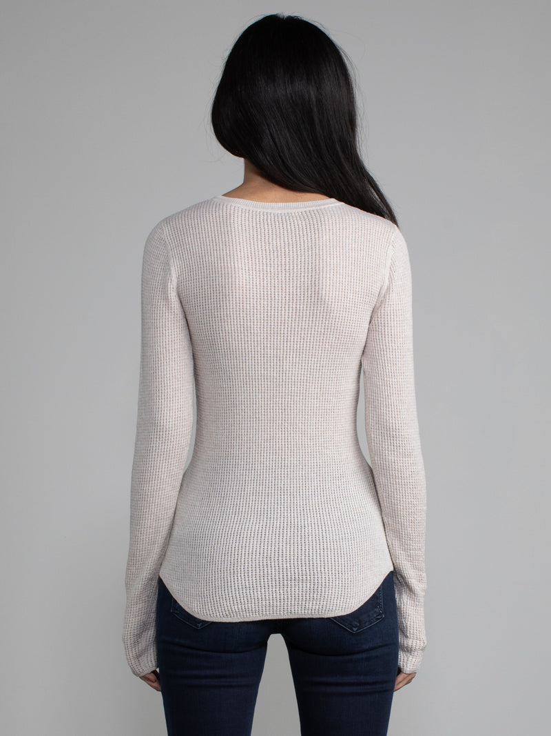 Female model in a white long sleeve