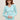 Woman wearing the Shirttail Waffle Vee, a blue waffle knit long sleeve vneck shirt by Margaret O'Leary.