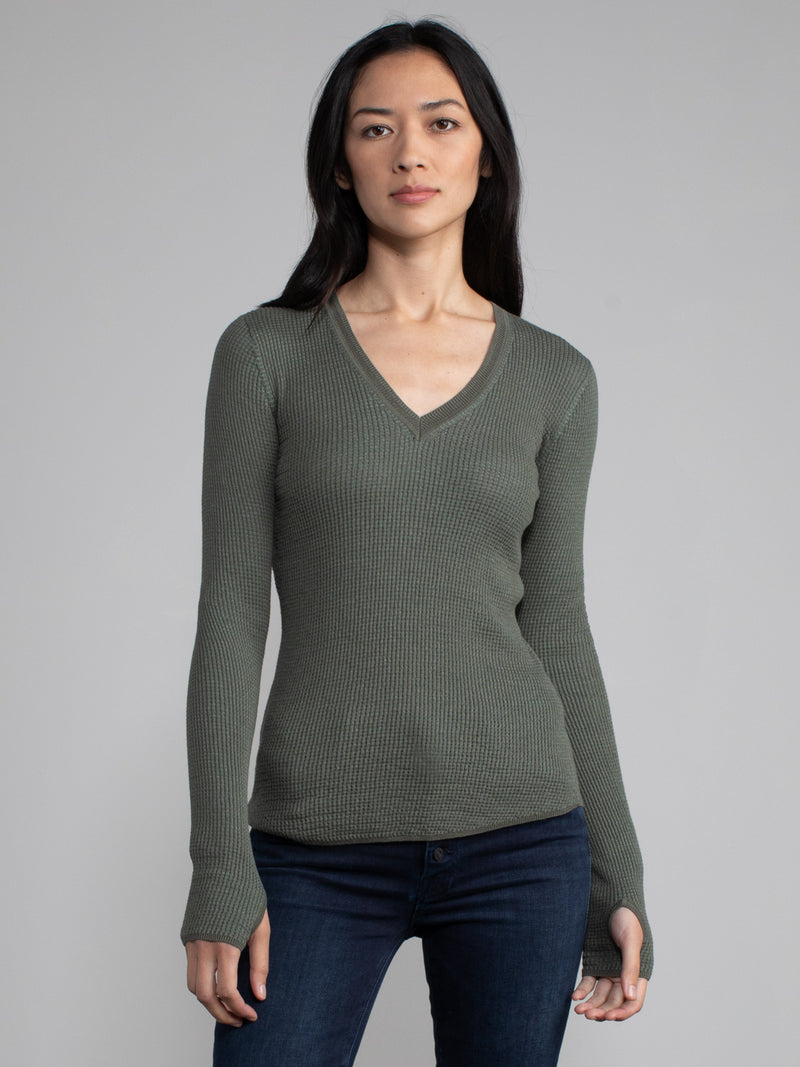 Female model in green waffle long sleeve