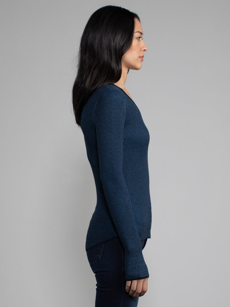 Female model in blue long sleeve