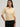 3D Polo by Margaret O’Leary, textured knit polo sweater with relaxed fit and collared neckline.