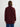 Woman wearing a Claude Jacket by Margaret O’Leary, a burgundy knit jacket with shawl collar styled over a plain top.