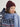 Woman wearing a Double Cashmere Beanie by Margaret O’Leary, a burgundy knit hat styled with a fair isle cardigan and light blue fringe scarf.