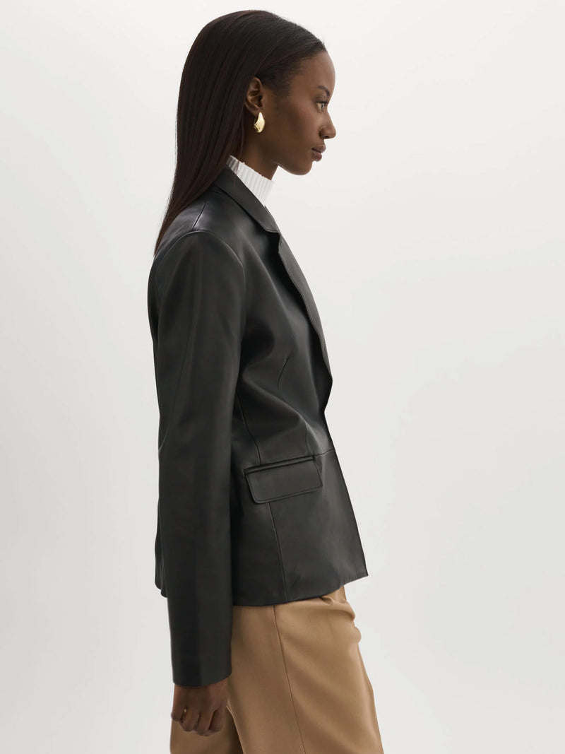 Woman wearing the Elza Leather Blazer in Black.